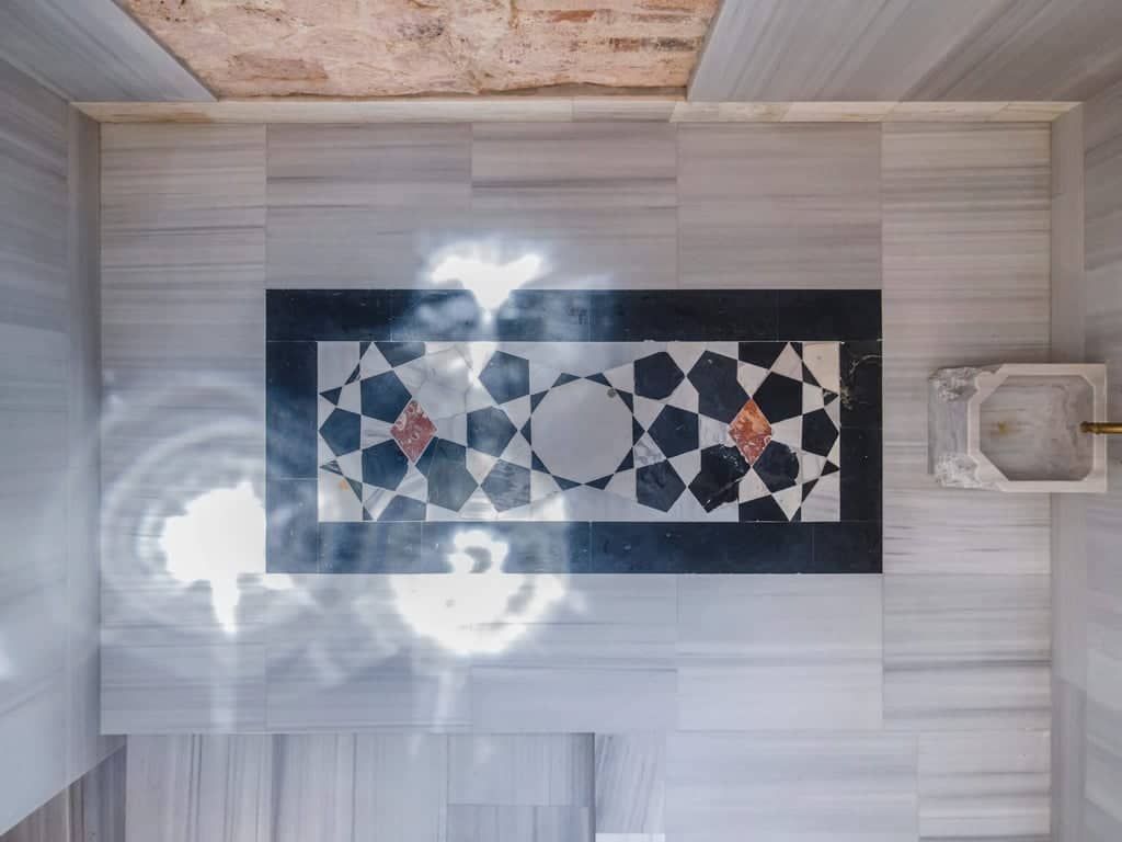 Polished marble floor with intricate black-and-white geometric pattern