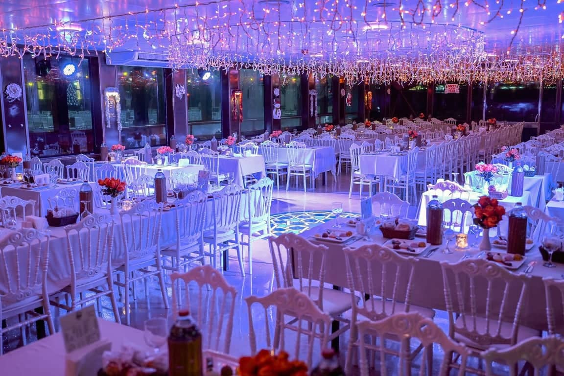 Elegant dinner setup with chandeliers onboard Bosphorus cruise ship before guests arrive ✨