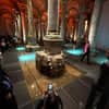 Visitors near the Medusa head base inside the Basilica Cistern