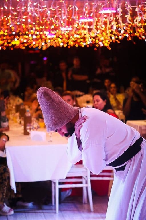 Whirling Dervish performance on stage during Bosphorus dinner cruise show