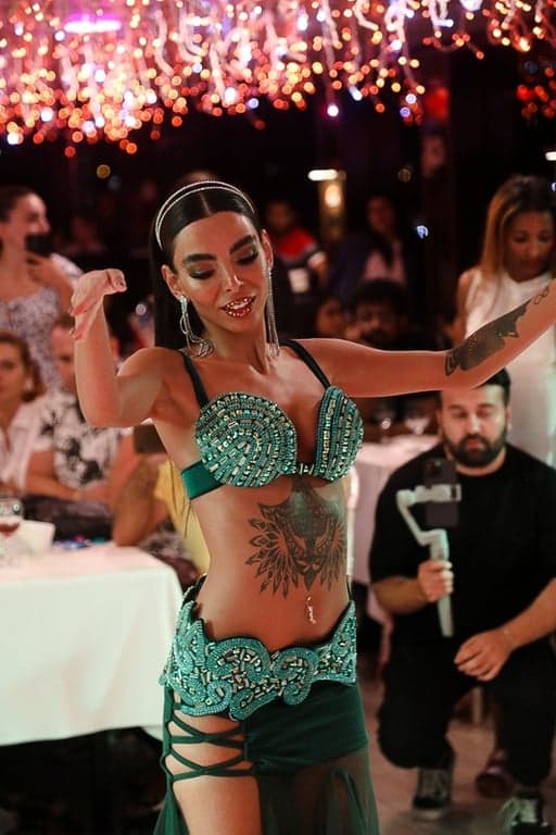 Belly dancer entertaining guests during Bosphorus dinner cruise night show 💃