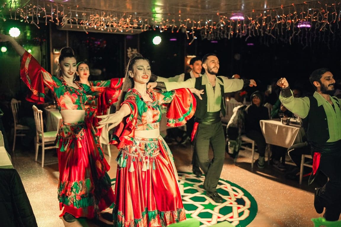 Folk dance troupe performing in colorful costumes on Bosphorus dinner cruise 🎶