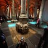 Visitors near the Medusa head base inside the Basilica Cistern